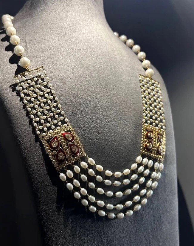 Layered pearl necklace with traditional decorative details